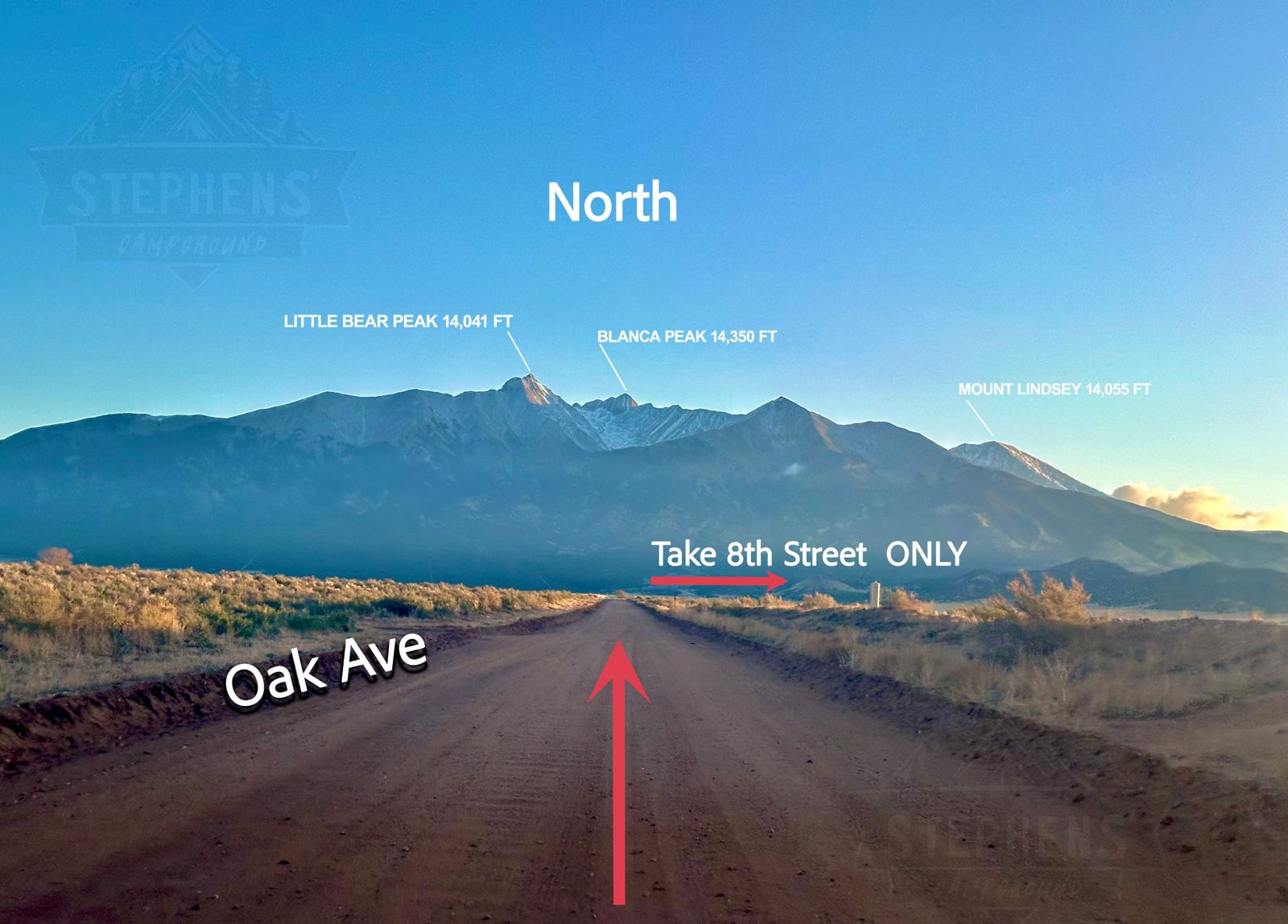 Looking north up Oak Ave dirt road toward Little Bear Peak, Blanca Peak and Mount Lindsey, with an arrow pointing right: Take 8th Street only